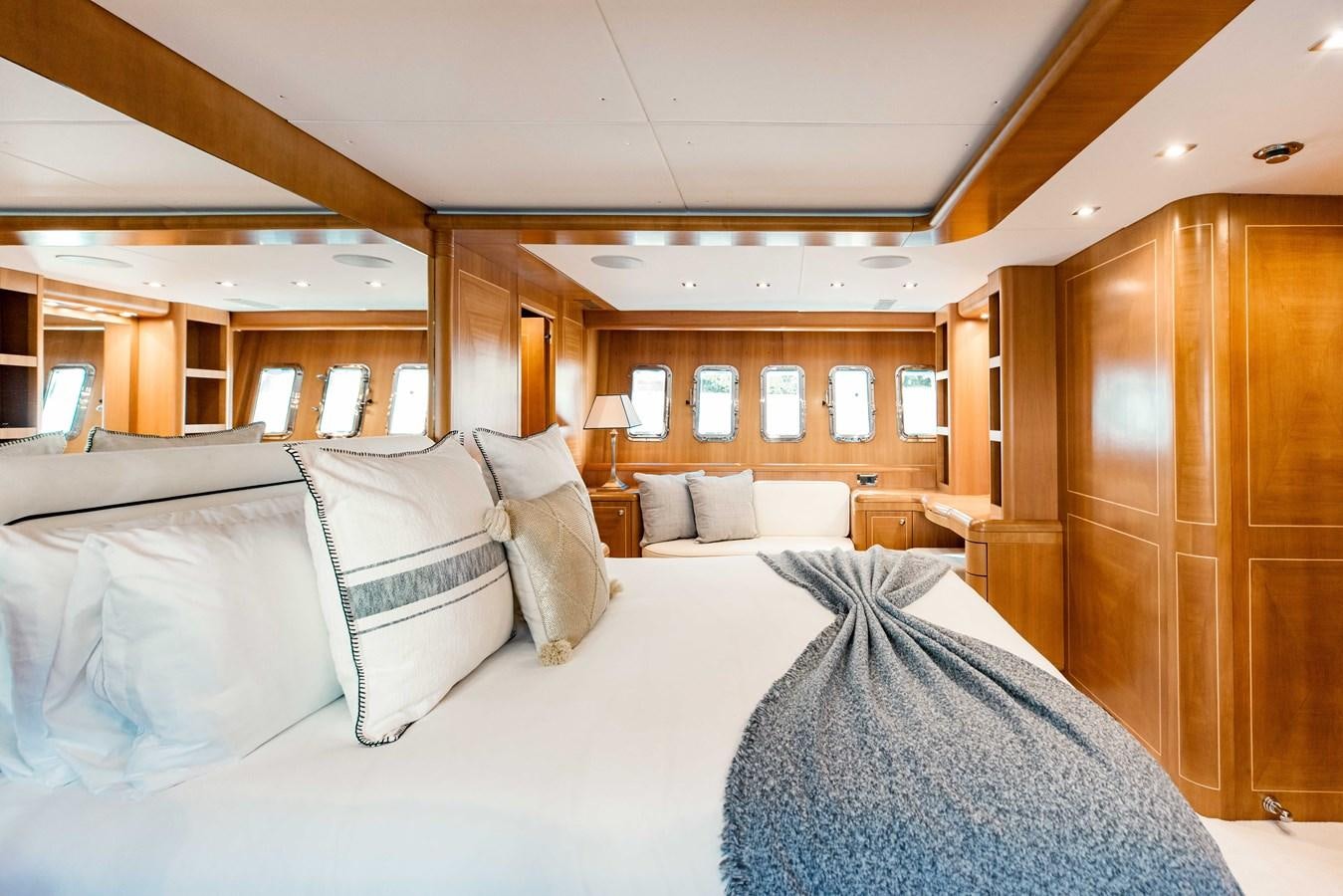 a room with a bed and a desk aboard 7 KNOTS Yacht for Sale
