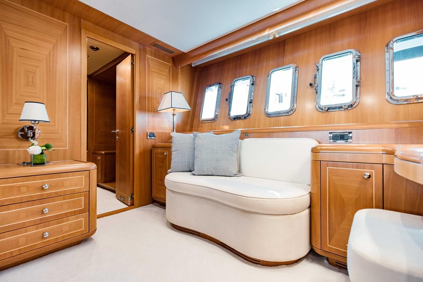 a room with a bed and a mirror aboard 7 KNOTS Yacht for Sale