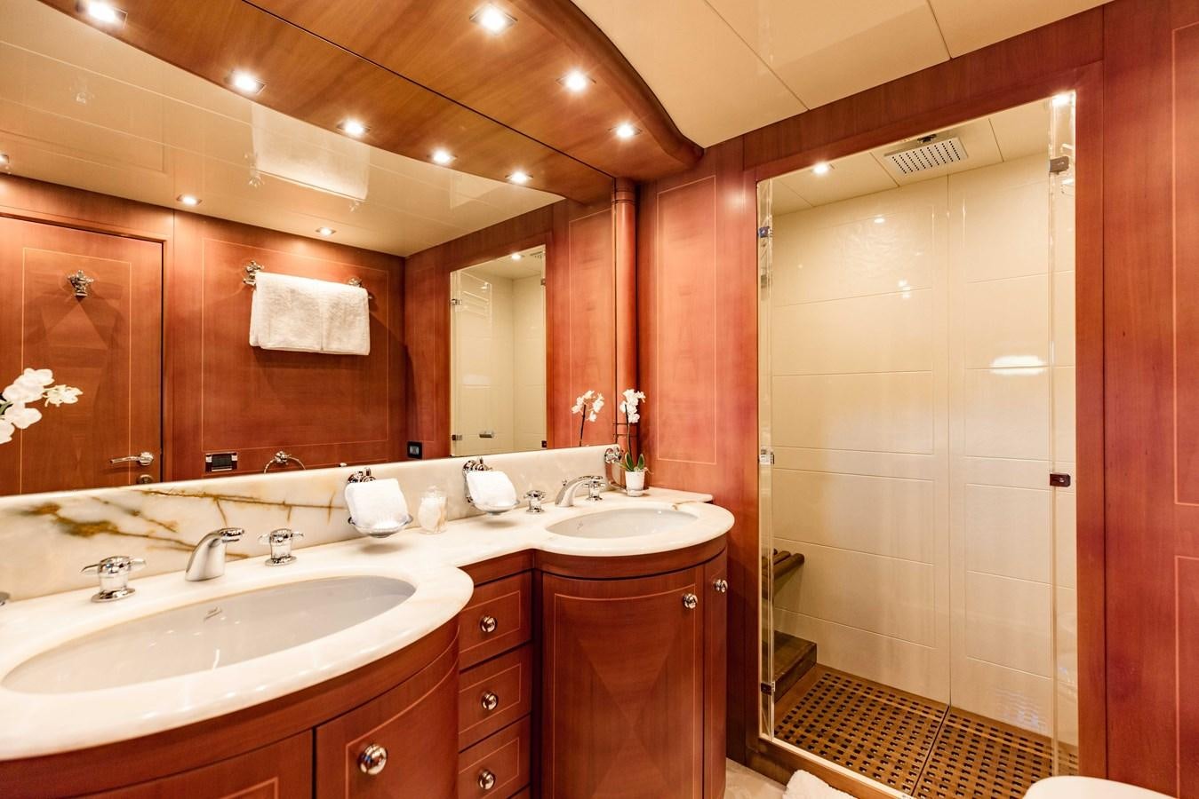 a bathroom with a large mirror aboard 7 KNOTS Yacht for Sale