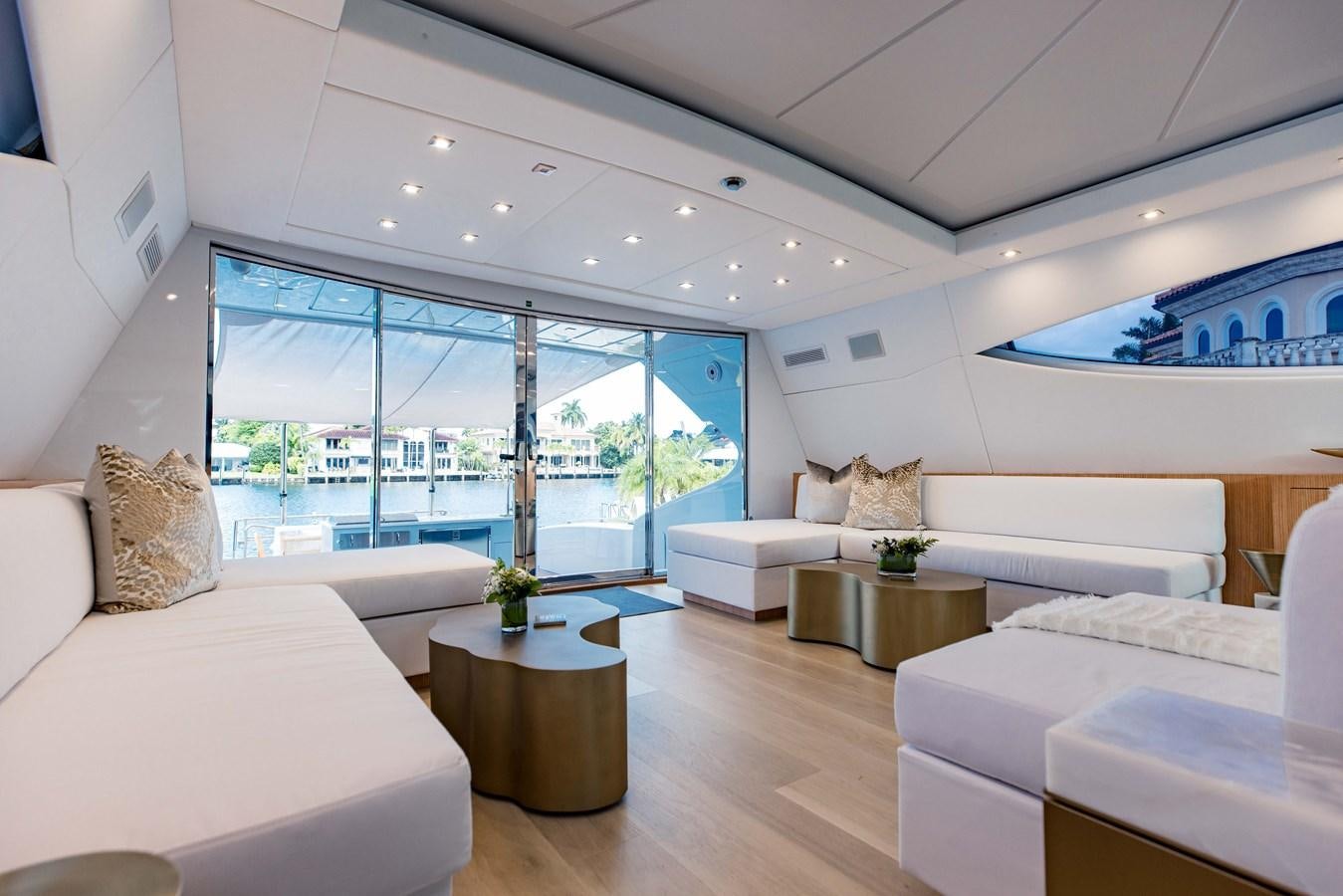 a living room with a large window aboard 7 KNOTS Yacht for Sale