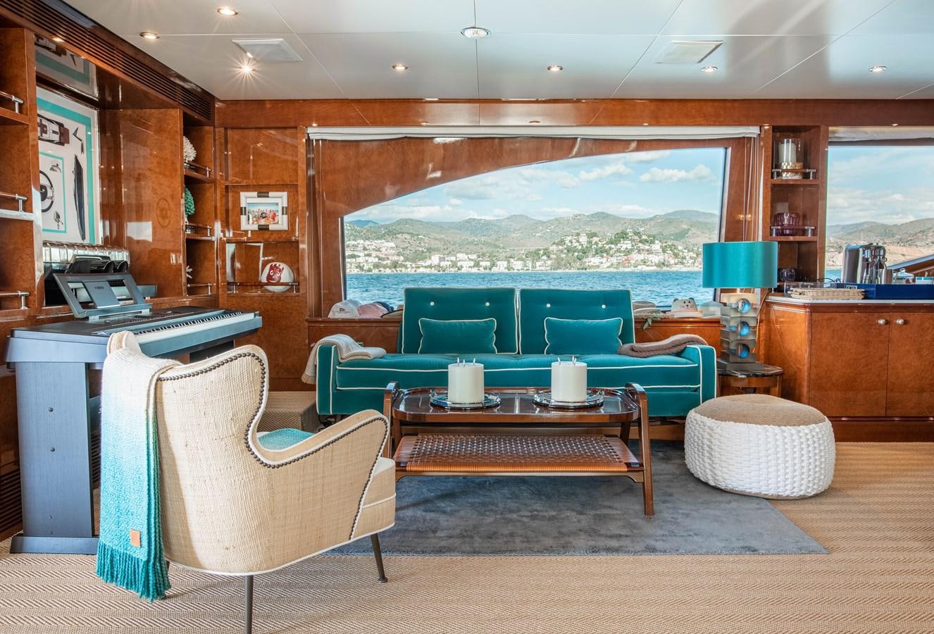 a room with a table chairs and a window aboard CHECKMATE Yacht for Sale