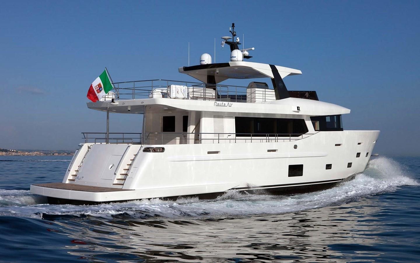 a large white boat on the water aboard YES Yacht for Sale