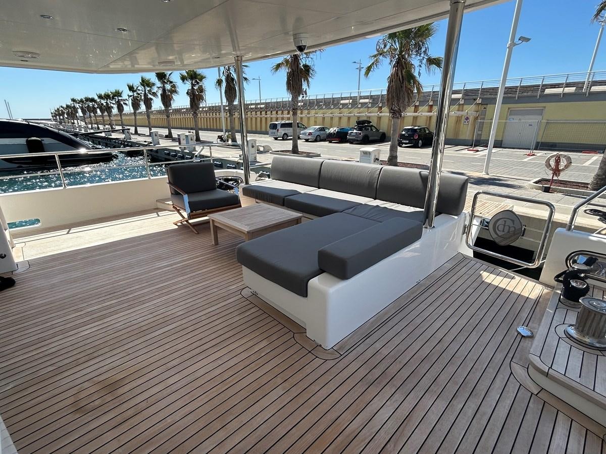 a deck with a pool and a deck with a deck and trees aboard YES Yacht for Sale
