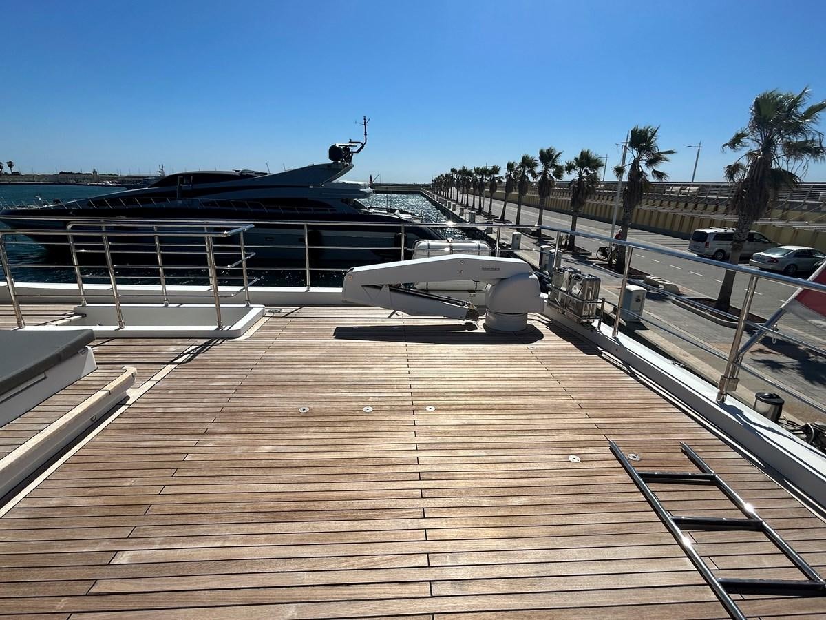 a dock with a boat and a helicopter on it aboard YES Yacht for Sale