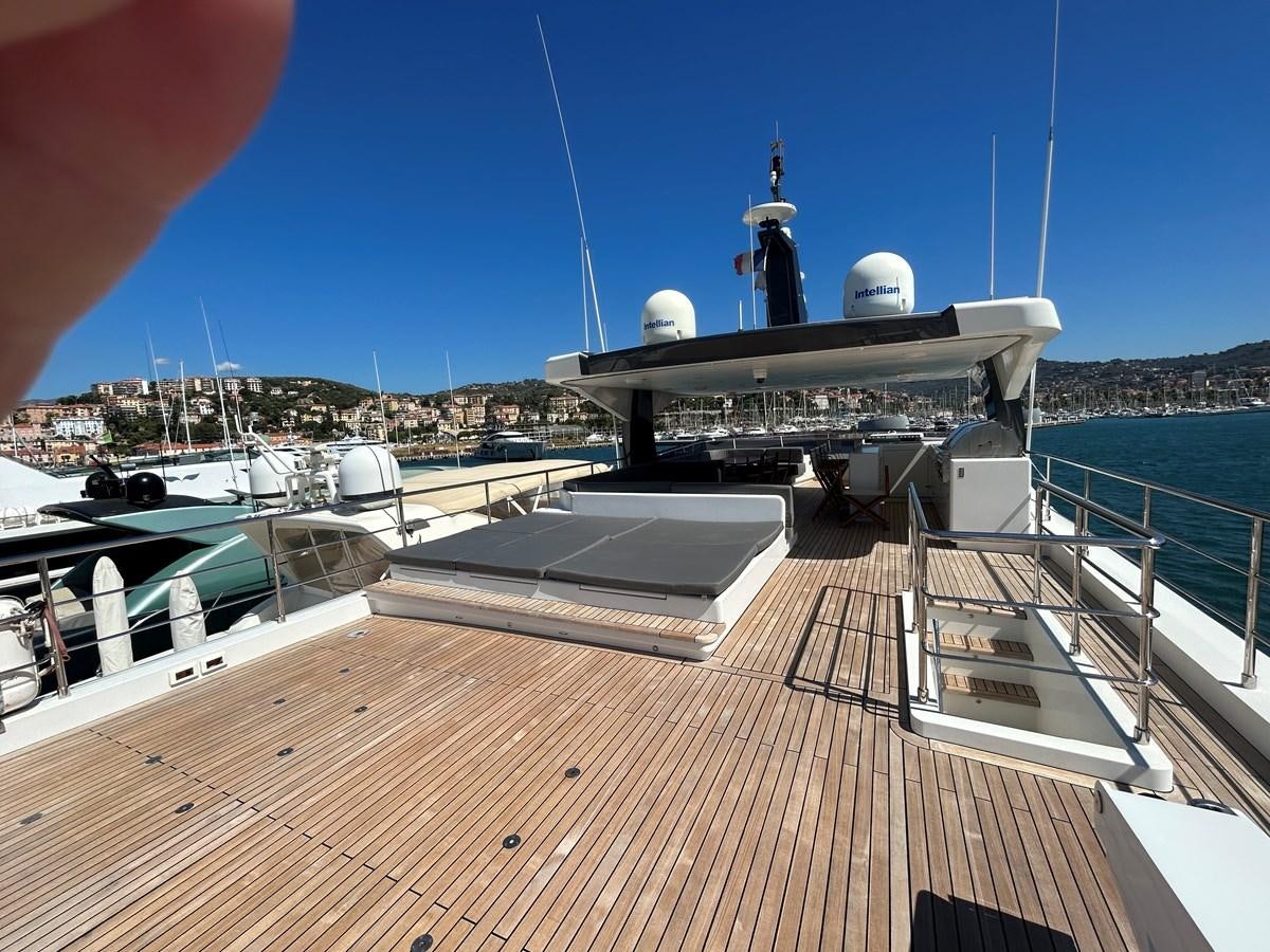 a deck with a large ship and a large ship on it aboard YES Yacht for Sale