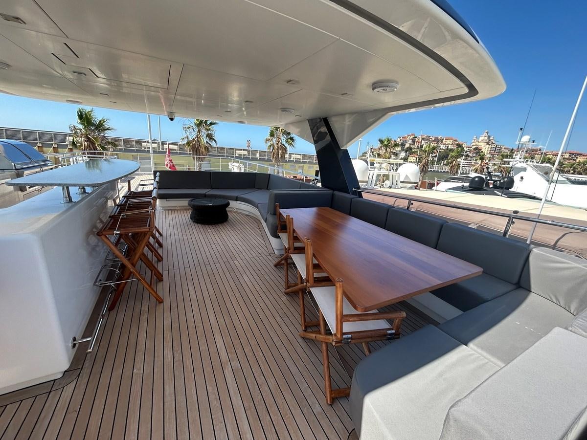 a deck with a view of a city and water aboard YES Yacht for Sale