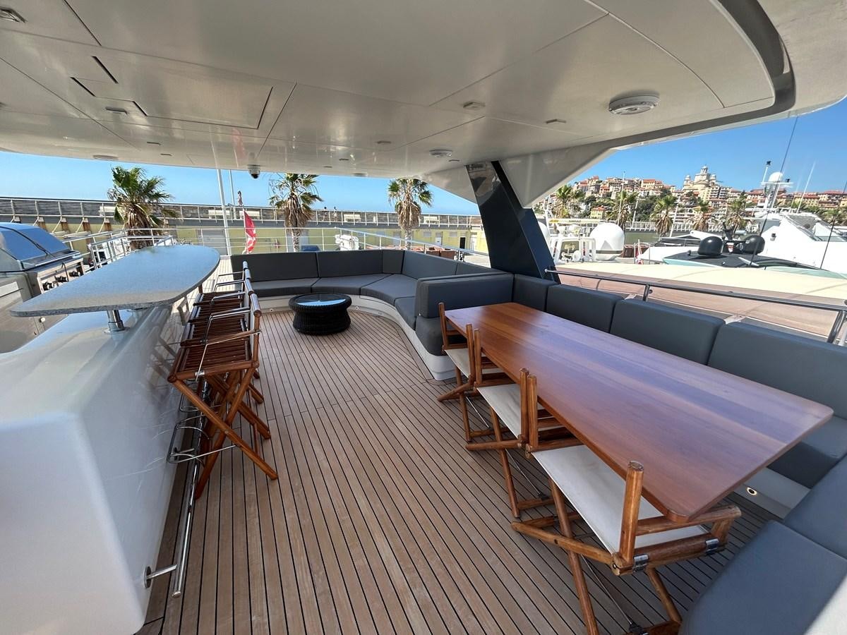 a deck with a deck and chairs aboard YES Yacht for Sale