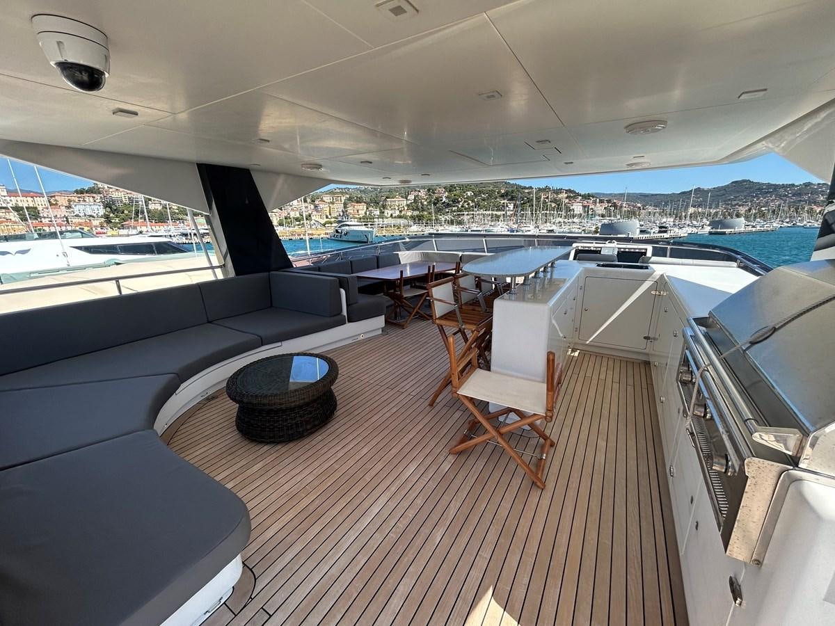 a room with a view of the water and a city aboard YES Yacht for Sale