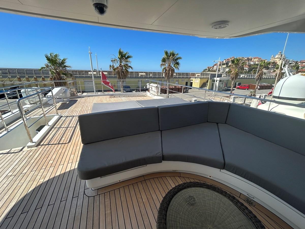 a deck with a large sofa aboard YES Yacht for Sale