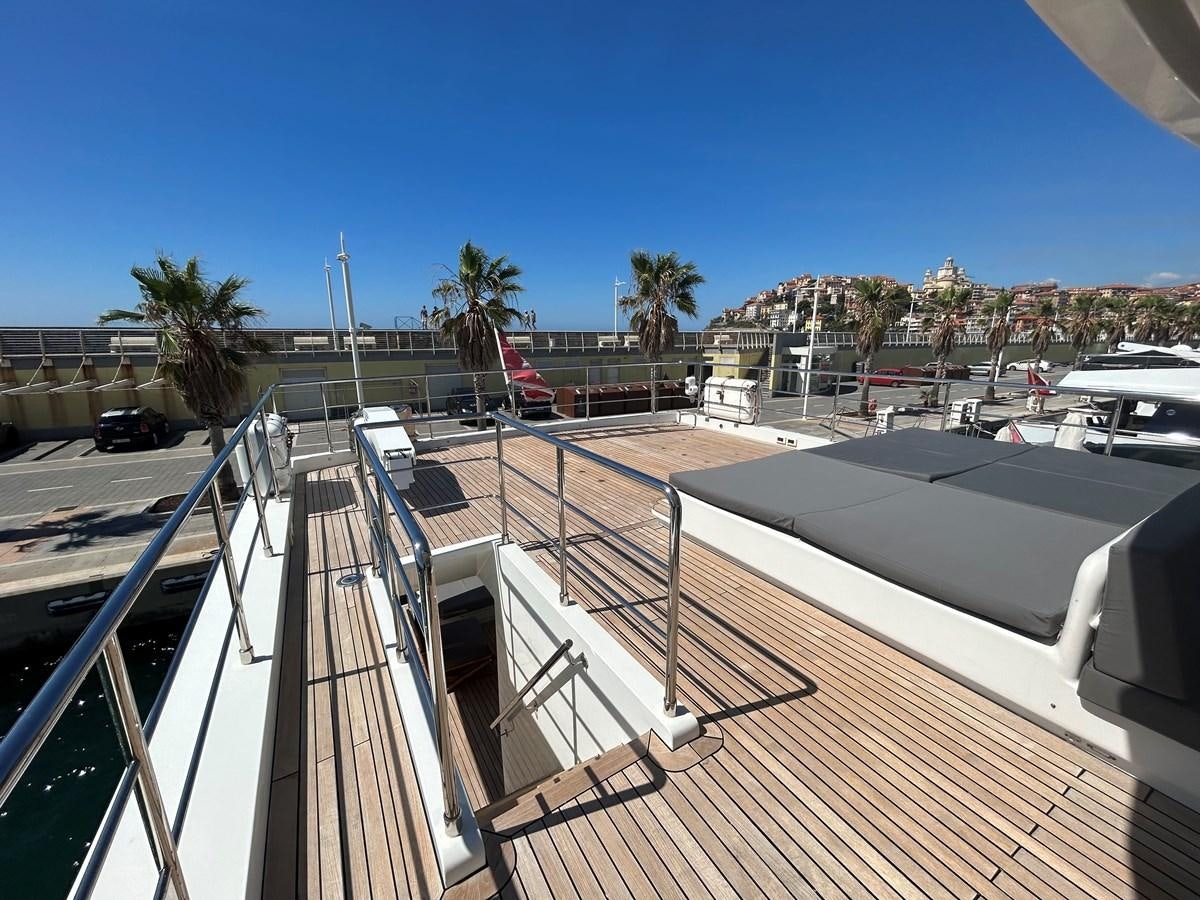 a deck with a flag on it aboard YES Yacht for Sale