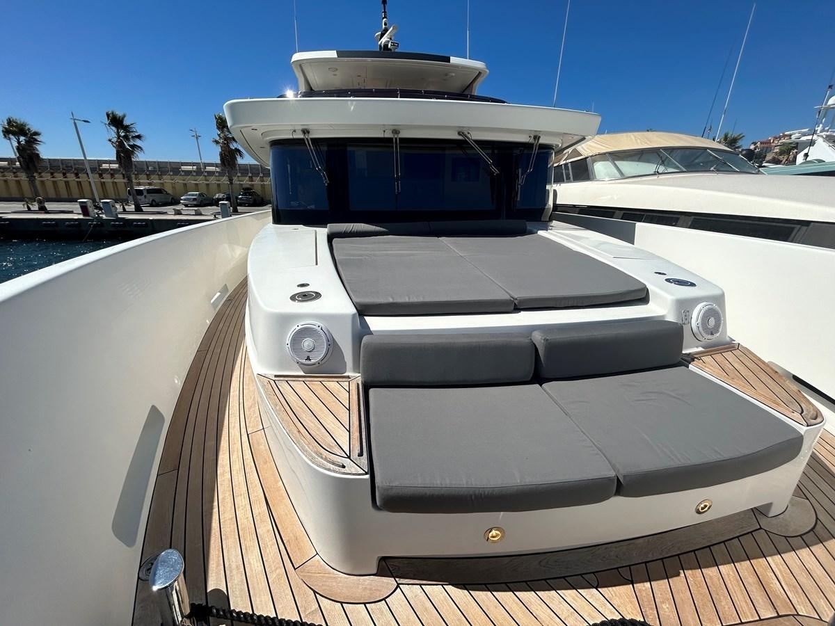 a white car on a deck aboard YES Yacht for Sale