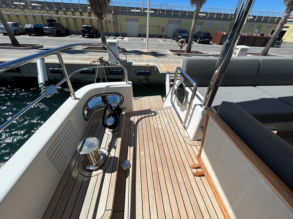 a deck with a car and a boat on it aboard YES Yacht for Sale