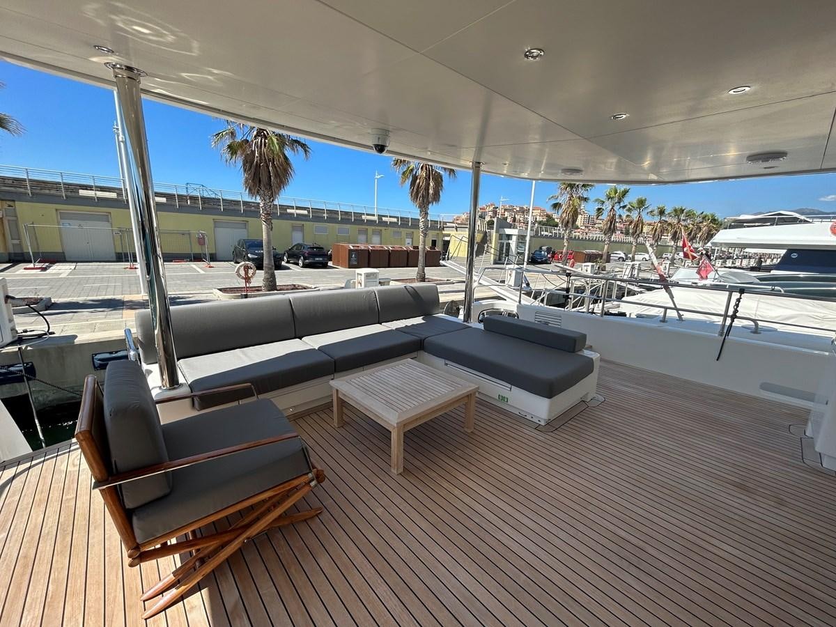 a deck with a pool and boats aboard YES Yacht for Sale