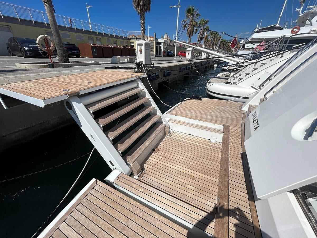 a deck with boats parked on it aboard YES Yacht for Sale
