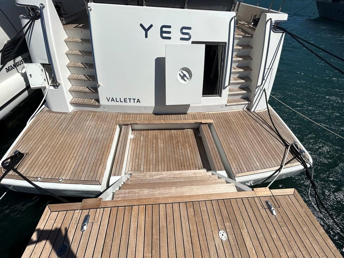 a white box on a wooden deck aboard YES Yacht for Sale