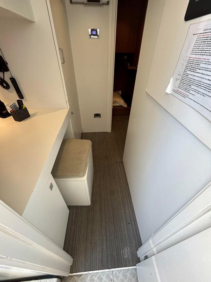 a hallway with a white door aboard YES Yacht for Sale