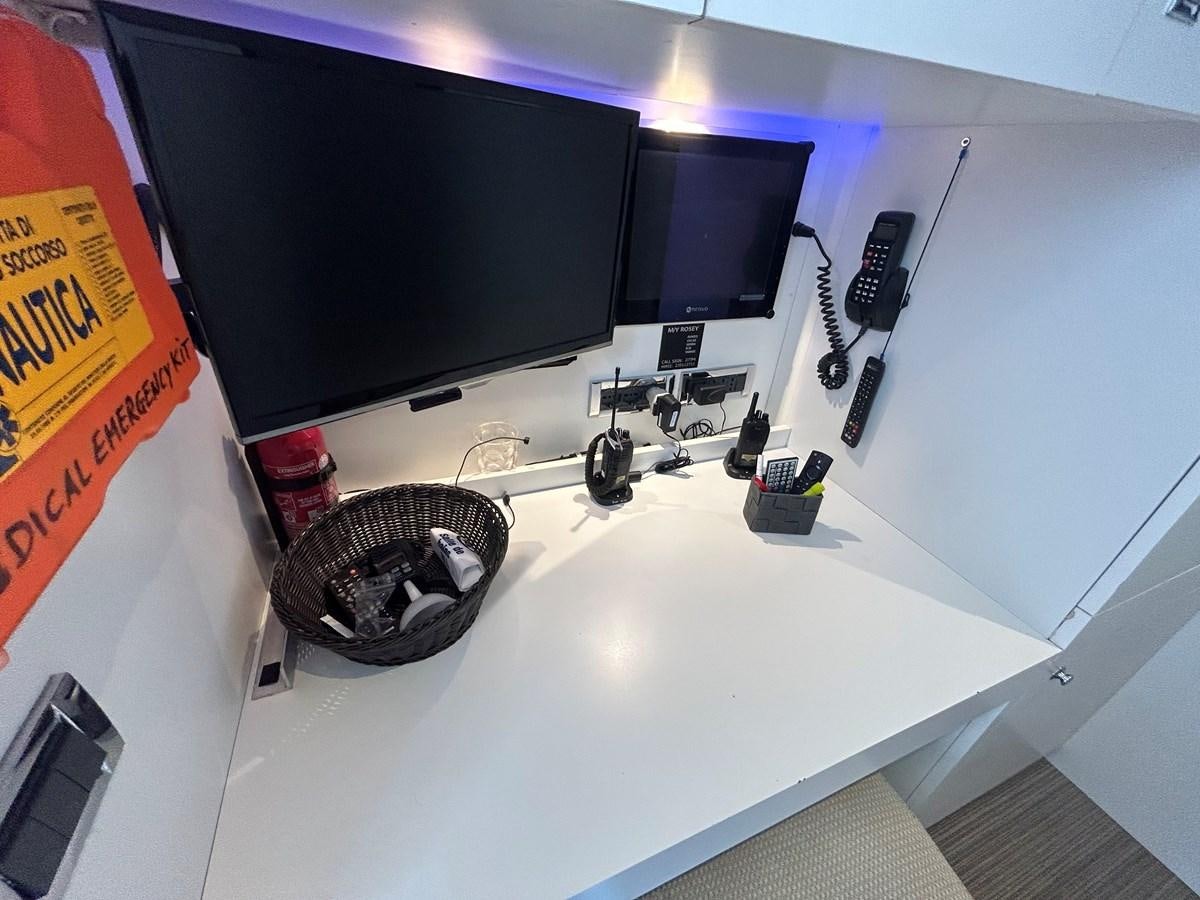 a sink with a television on the wall aboard YES Yacht for Sale