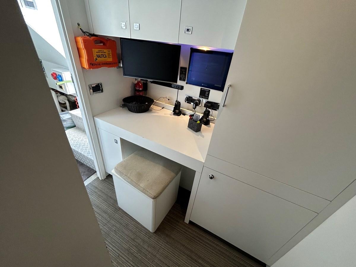 a kitchen with a small island aboard YES Yacht for Sale