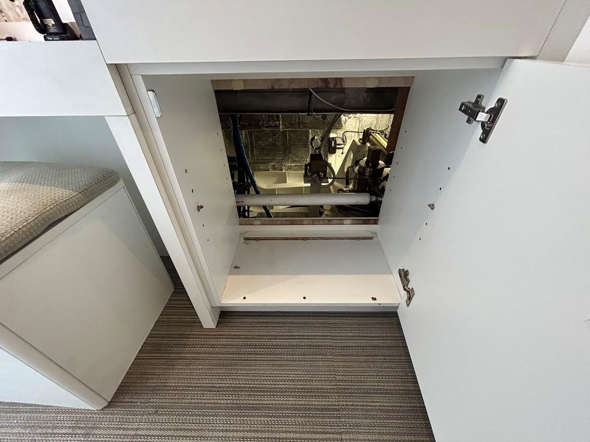 a hallway with a door and a window aboard YES Yacht for Sale