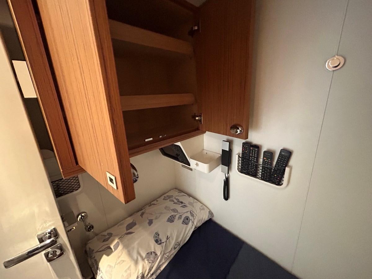 a bed in a room aboard YES Yacht for Sale