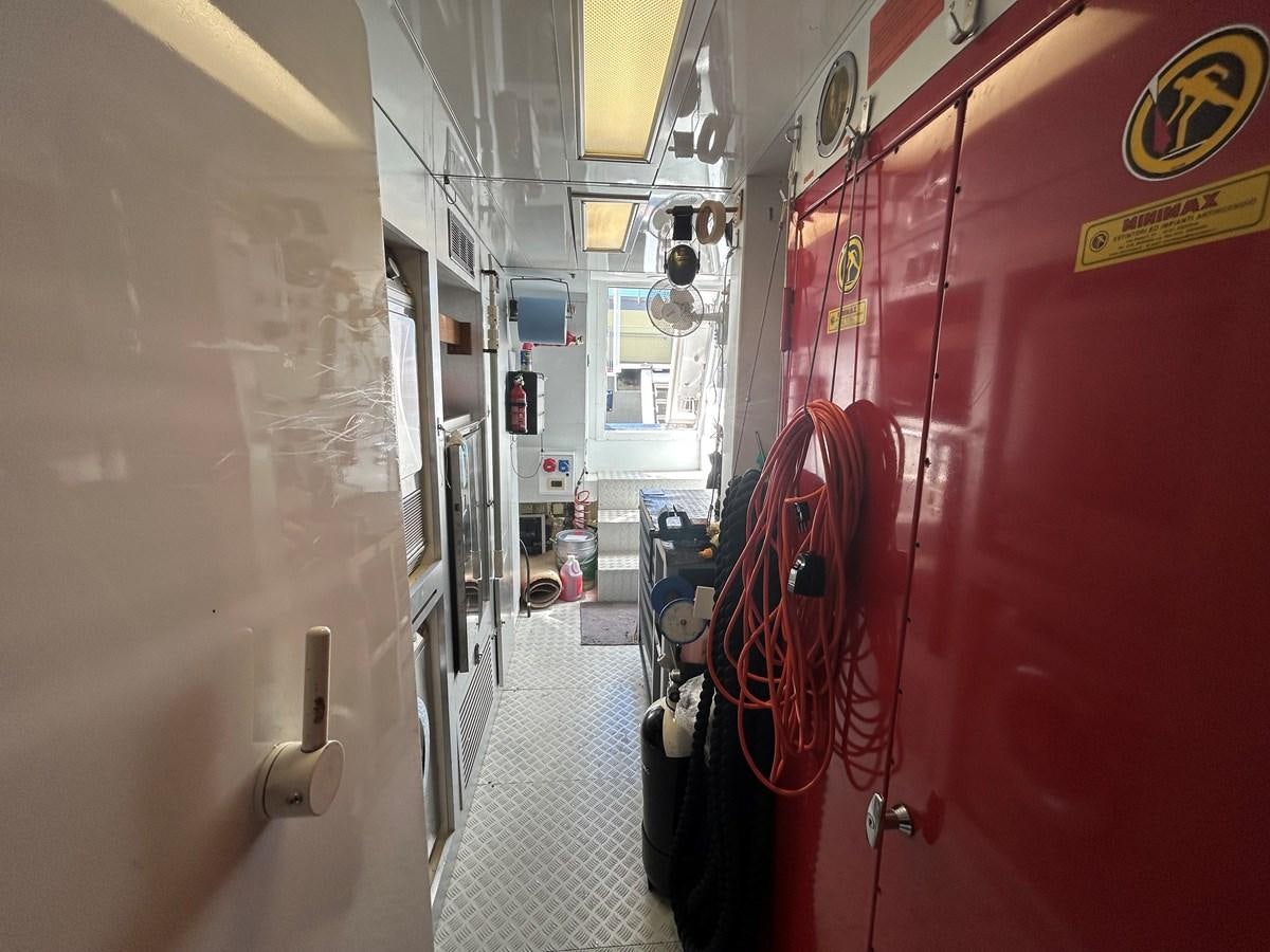 a train with red and white graffiti aboard YES Yacht for Sale