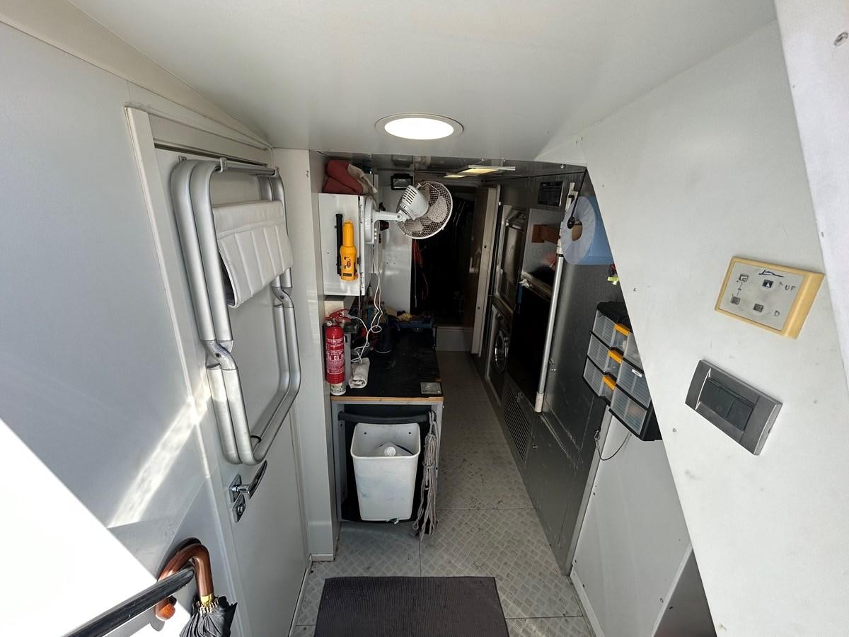 a hallway with a lot of objects aboard YES Yacht for Sale