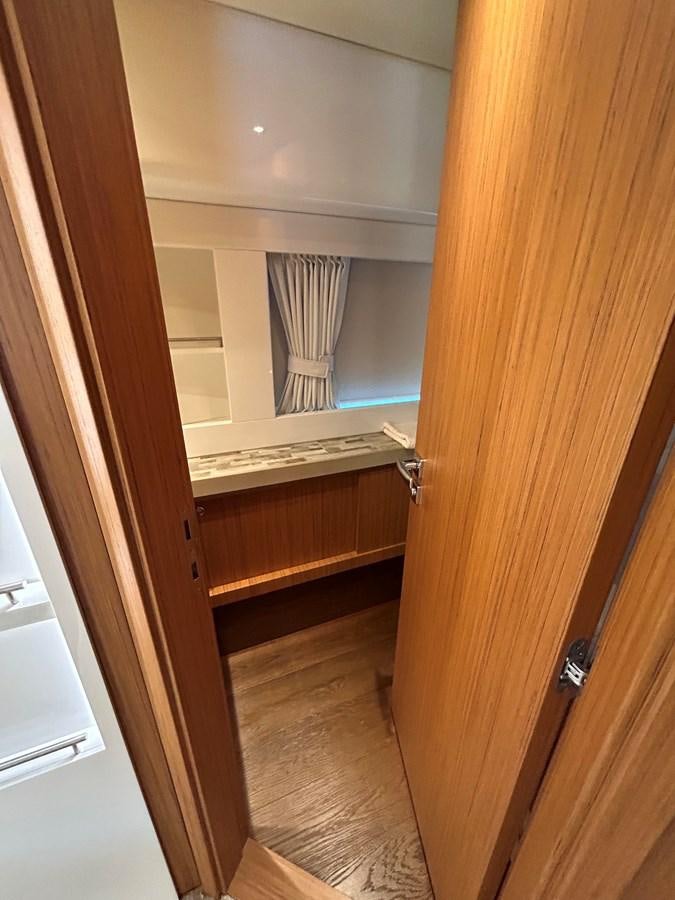 a room with a window and a curtain aboard YES Yacht for Sale