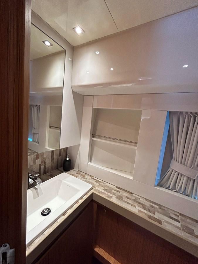 a bathroom with a sink and a mirror aboard YES Yacht for Sale