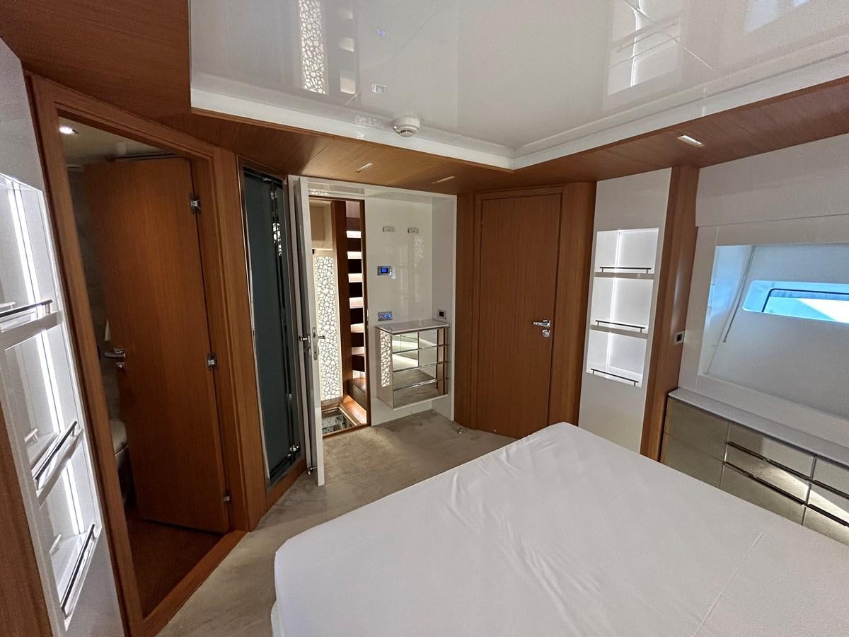a bedroom with a bed aboard YES Yacht for Sale
