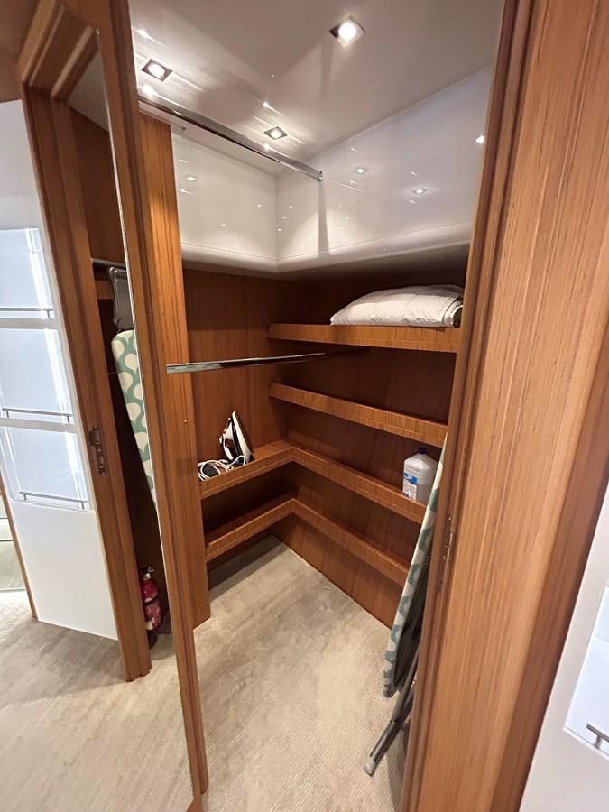 a wooden bunk bed in a room aboard YES Yacht for Sale