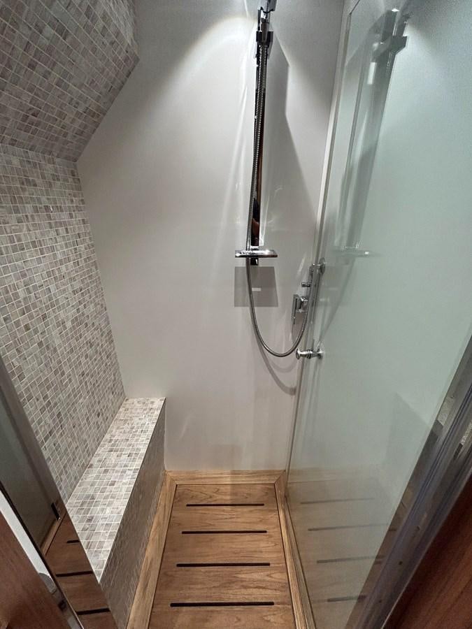 a hallway with a metal railing aboard YES Yacht for Sale