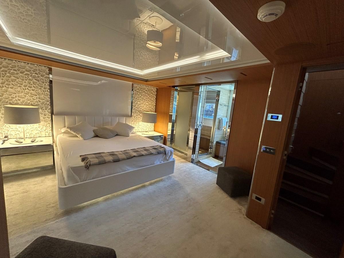 a bedroom with a bed aboard YES Yacht for Sale