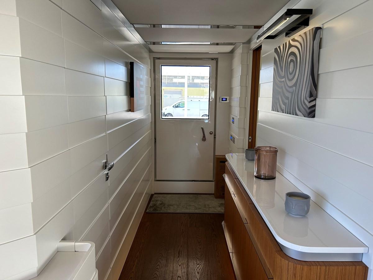 a bathroom with a countertop sink and a mirror aboard YES Yacht for Sale