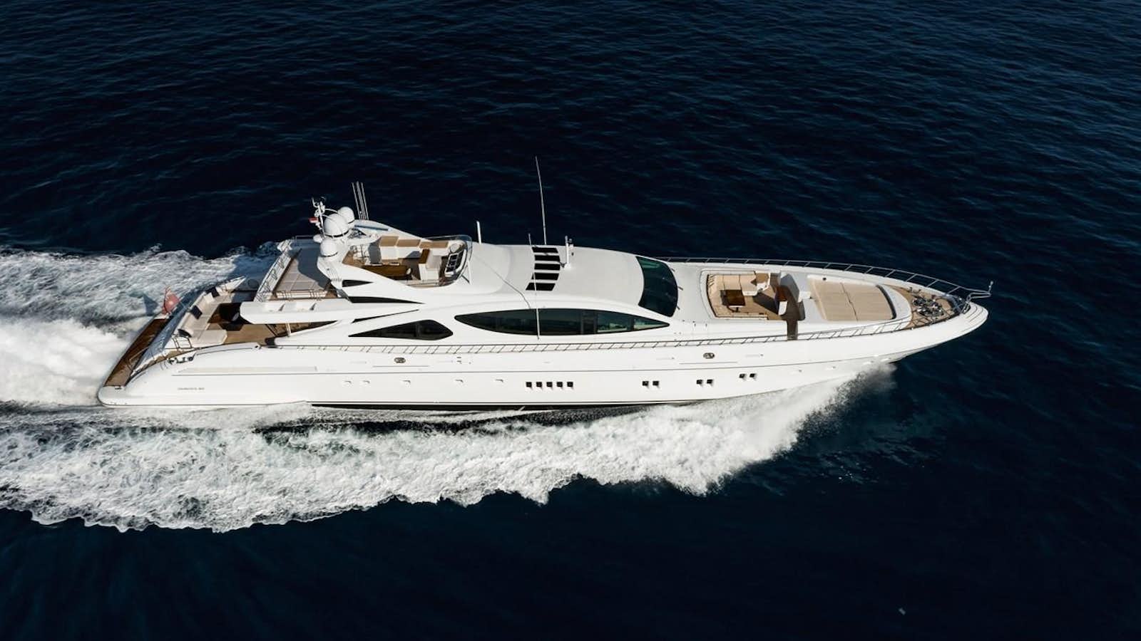 a white yacht on the water aboard ROYALE X Yacht for Sale