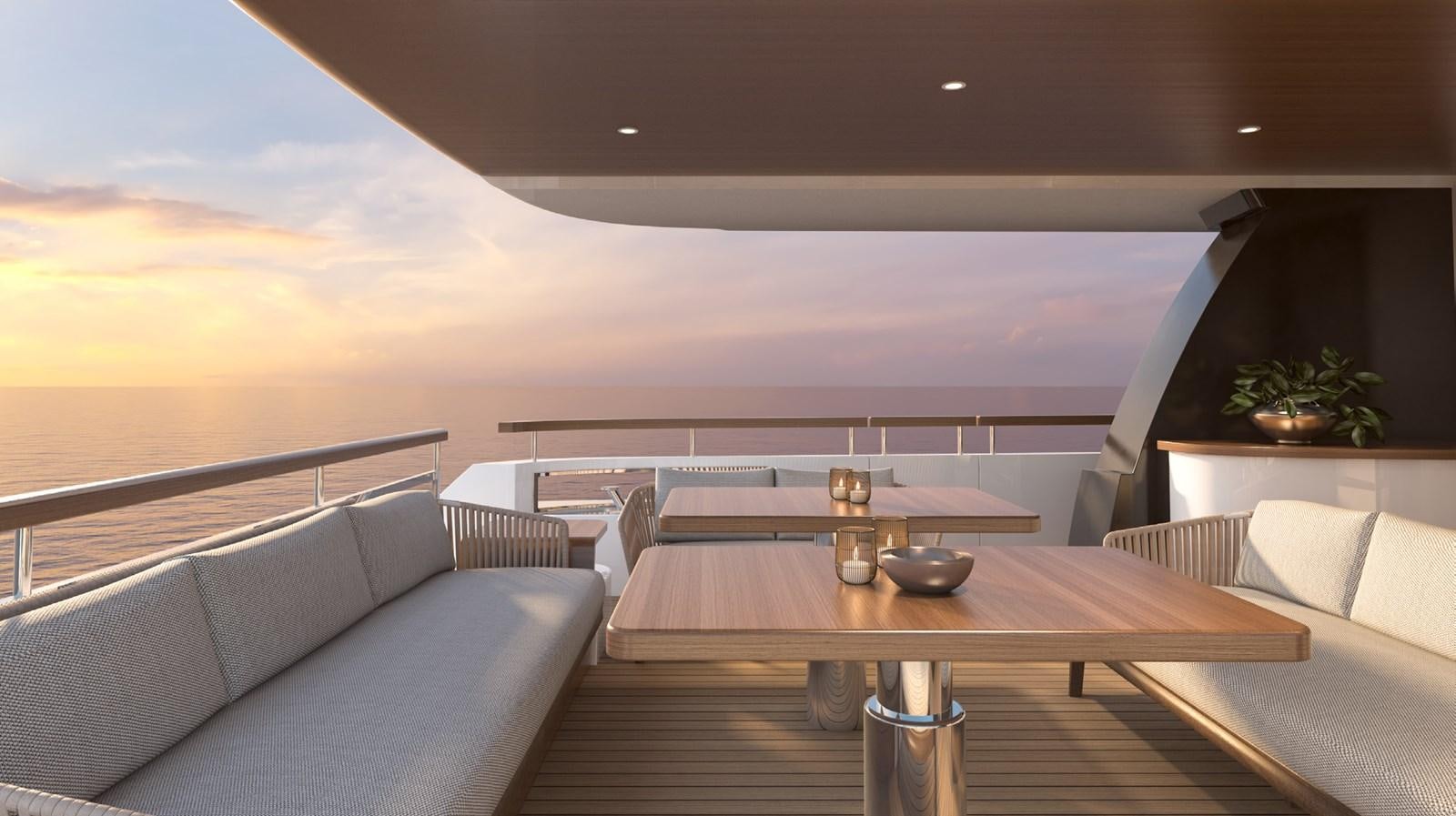 a table with a glass of wine on it aboard THE VESSEL Yacht for Sale