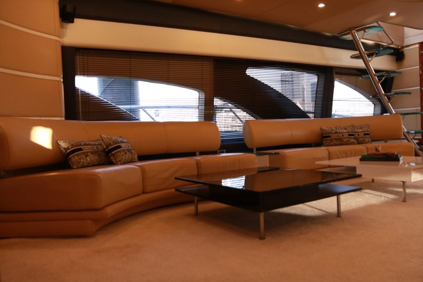 a living room with a couch and a coffee table aboard SIMONA Yacht for Sale