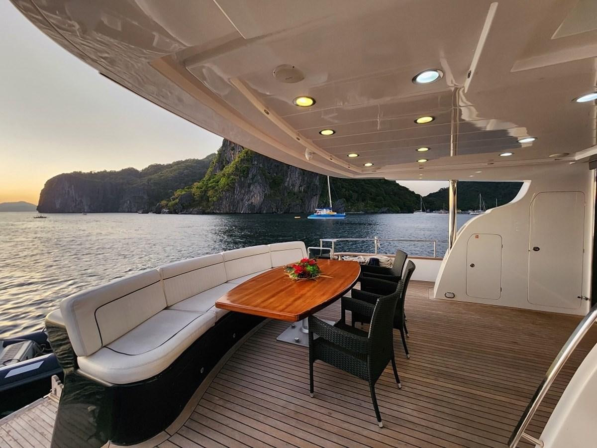 a table and chairs on a boat aboard BLUE SAPPHIRE Yacht for Sale
