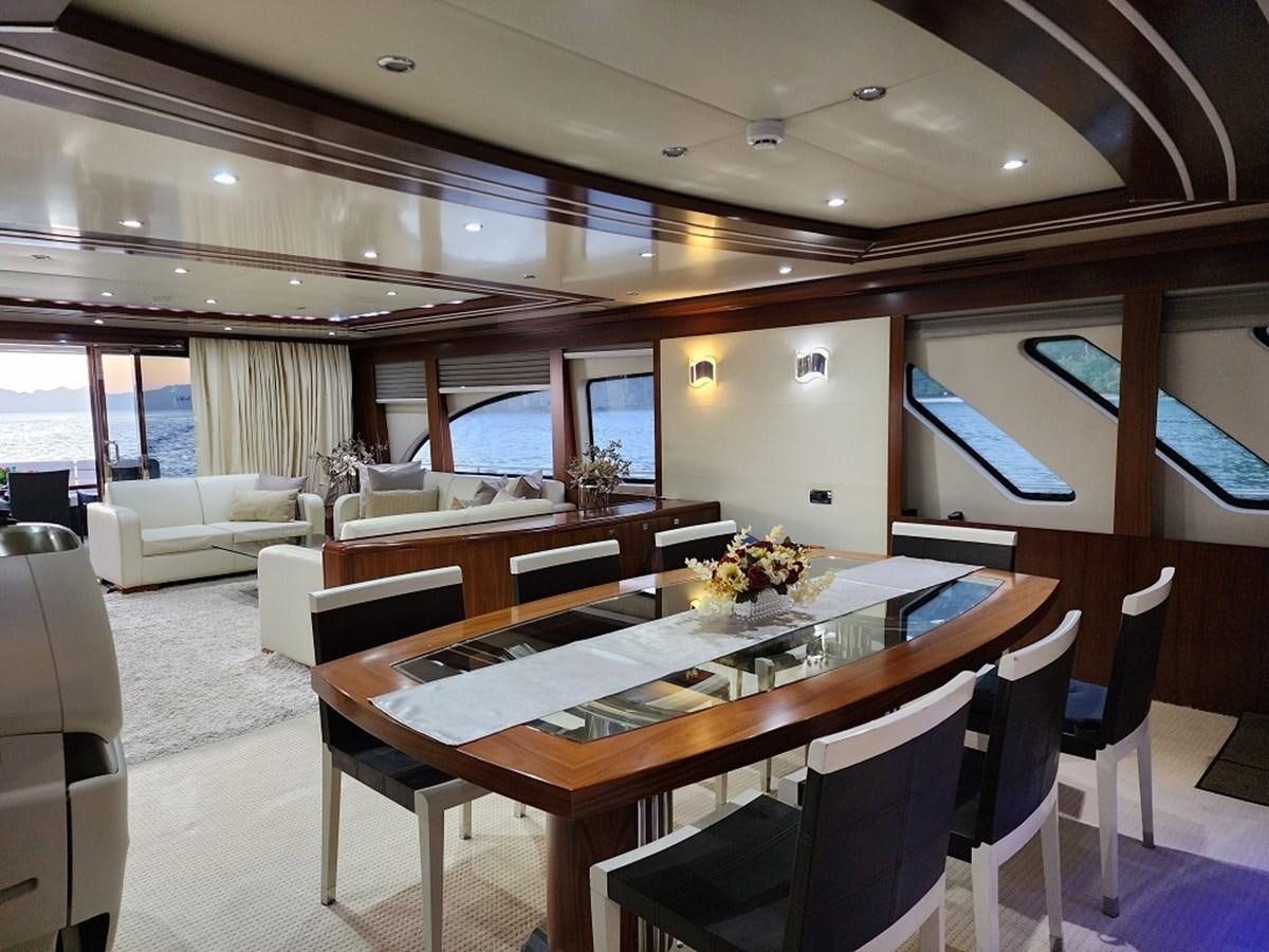 a large room with a table and chairs aboard BLUE SAPPHIRE Yacht for Sale