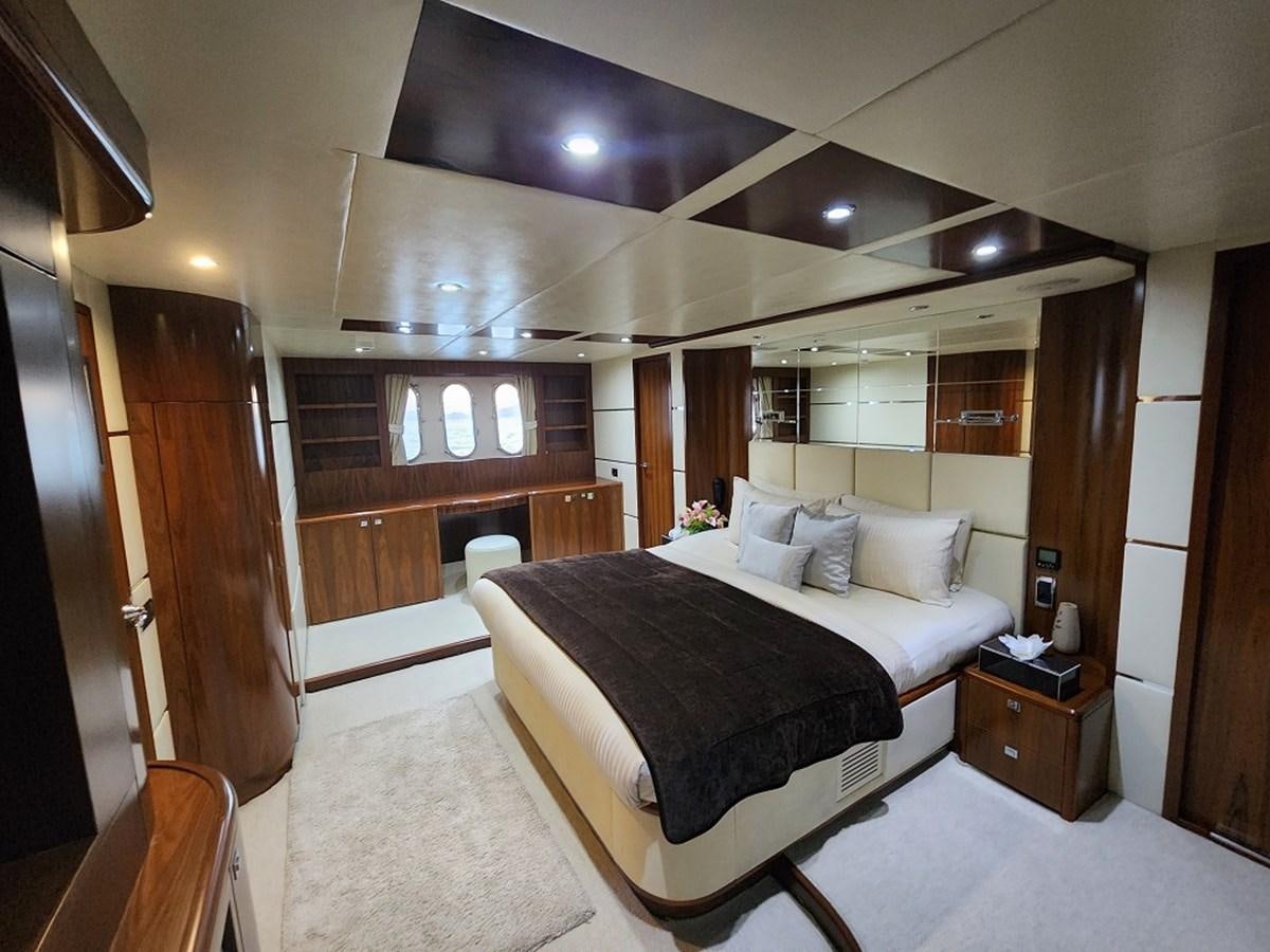 a bed in a room aboard BLUE SAPPHIRE Yacht for Sale