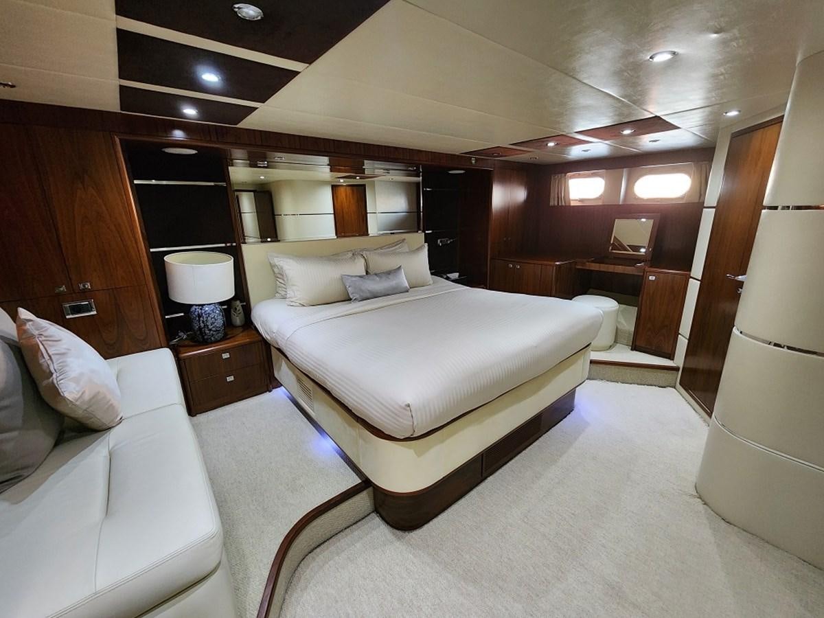 a room with a bed and a mirror aboard BLUE SAPPHIRE Yacht for Sale
