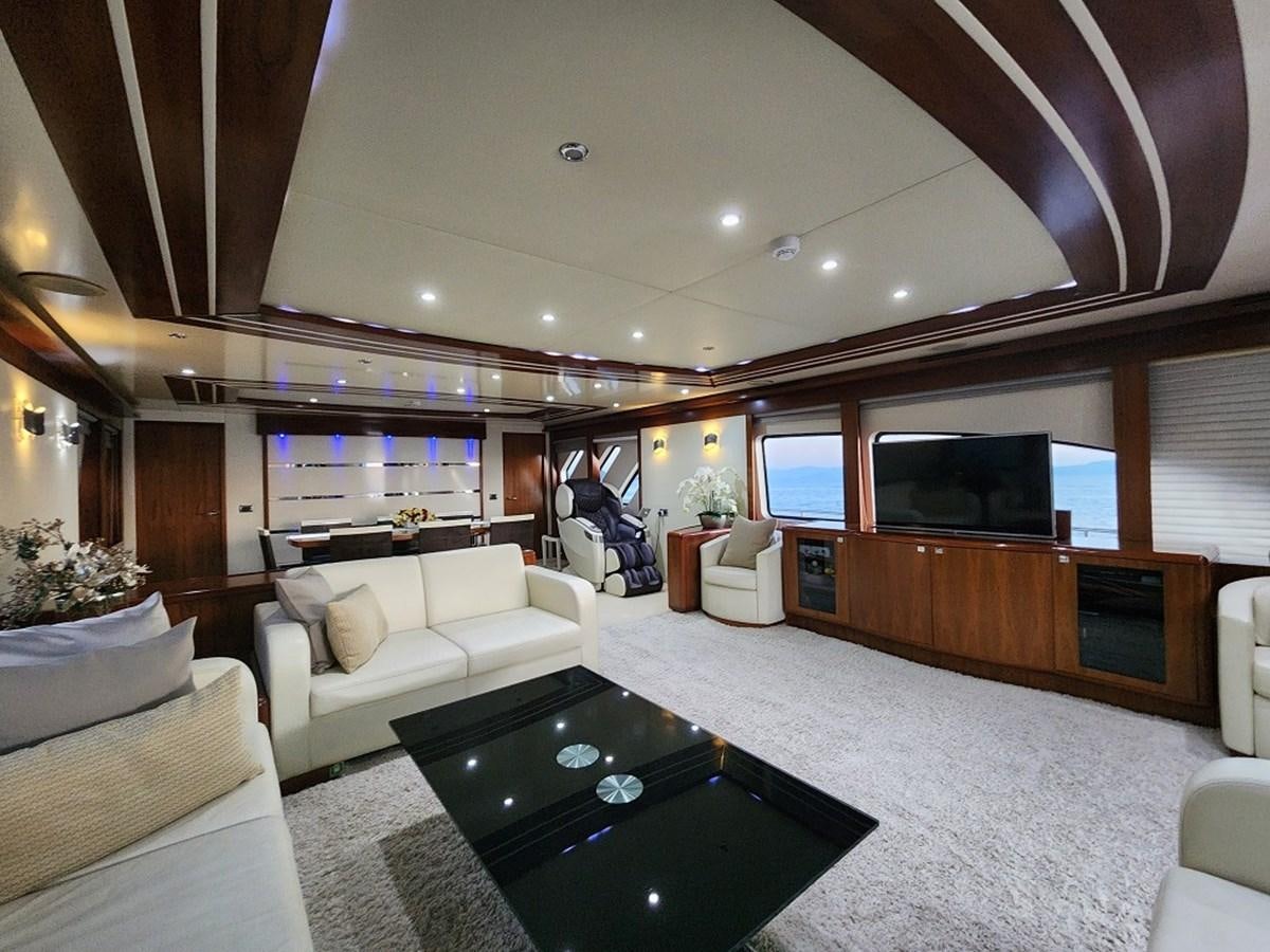 a living room with a large tv aboard BLUE SAPPHIRE Yacht for Sale