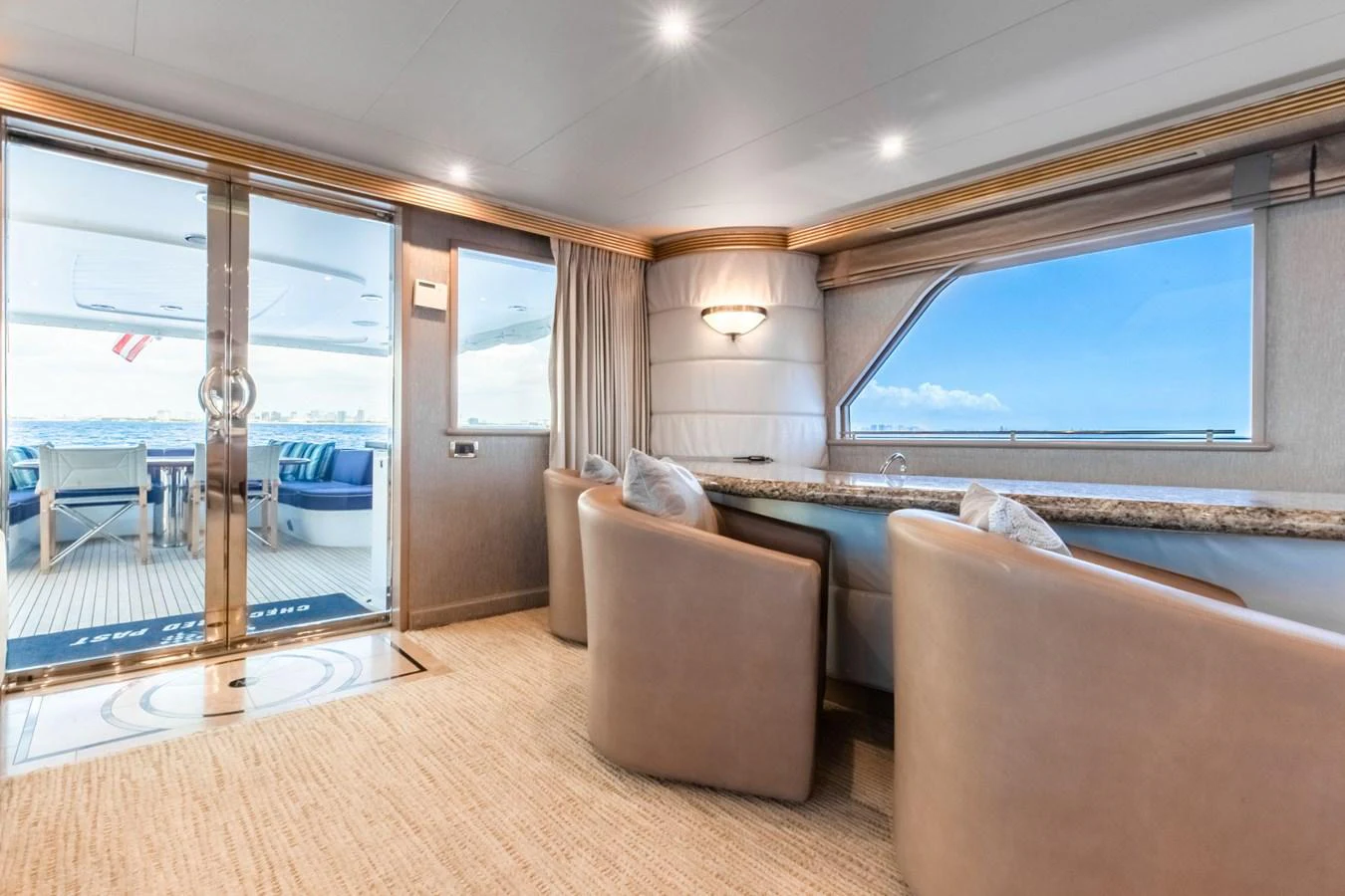 a large bedroom with a bed and a large window aboard CHECKERED PAST Yacht for Sale