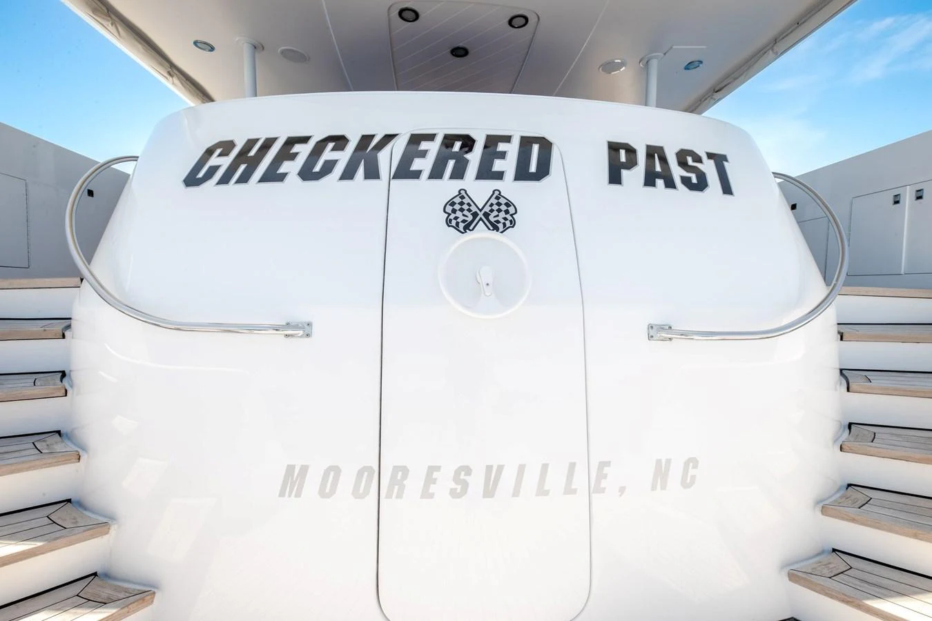 a white machine with a logo aboard CHECKERED PAST Yacht for Sale