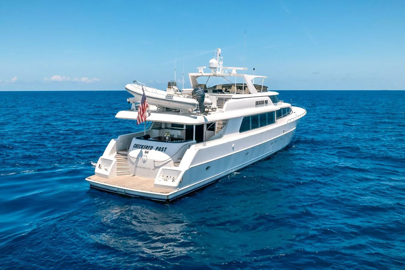 a boat in the water aboard CHECKERED PAST Yacht for Sale