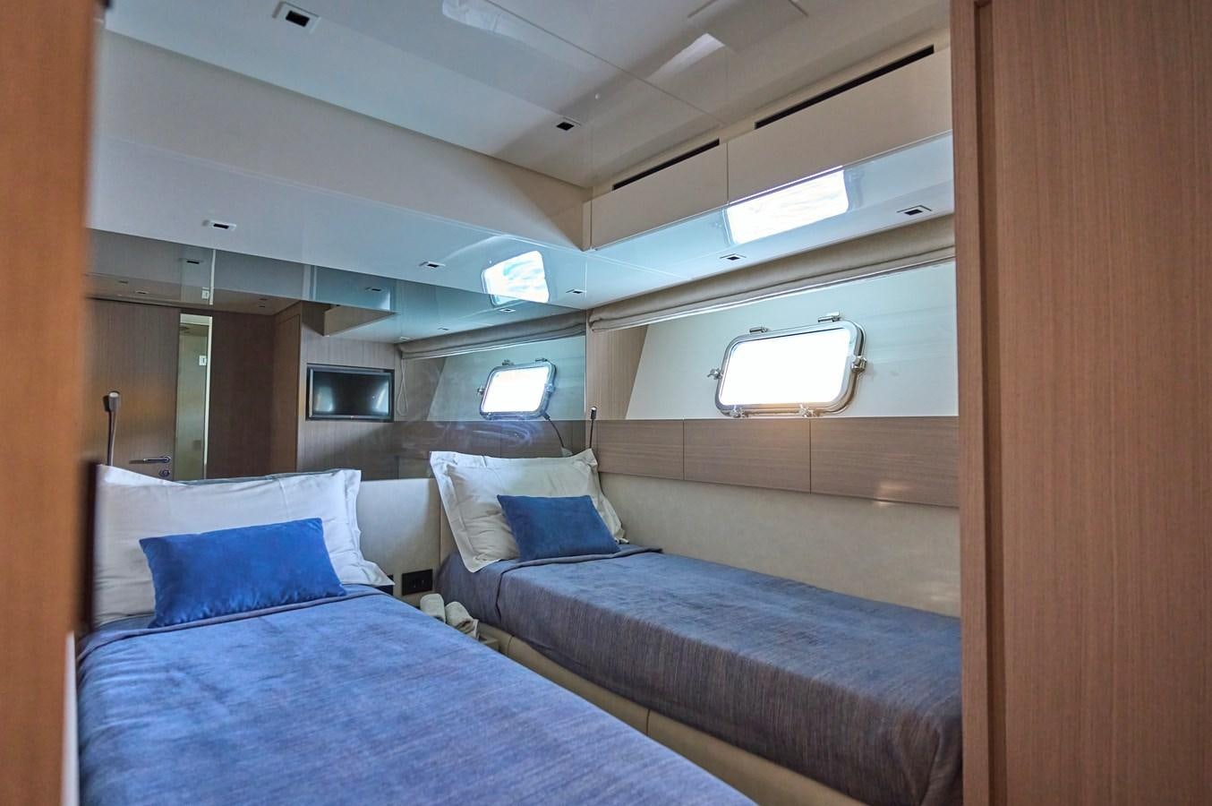 a room with two beds aboard ESTIA Yacht for Sale