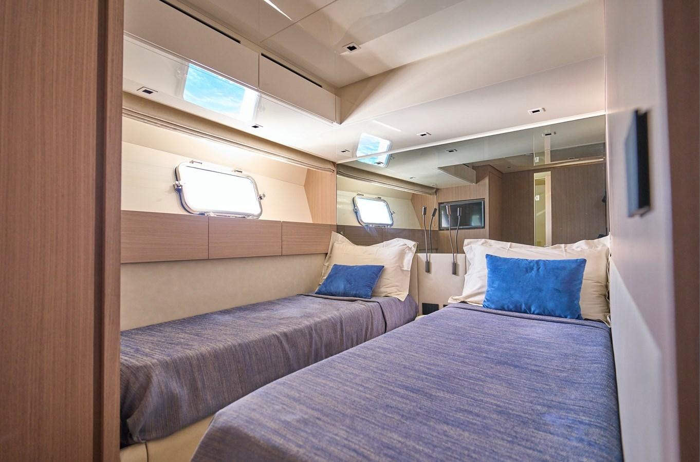a room with two beds aboard ESTIA Yacht for Sale