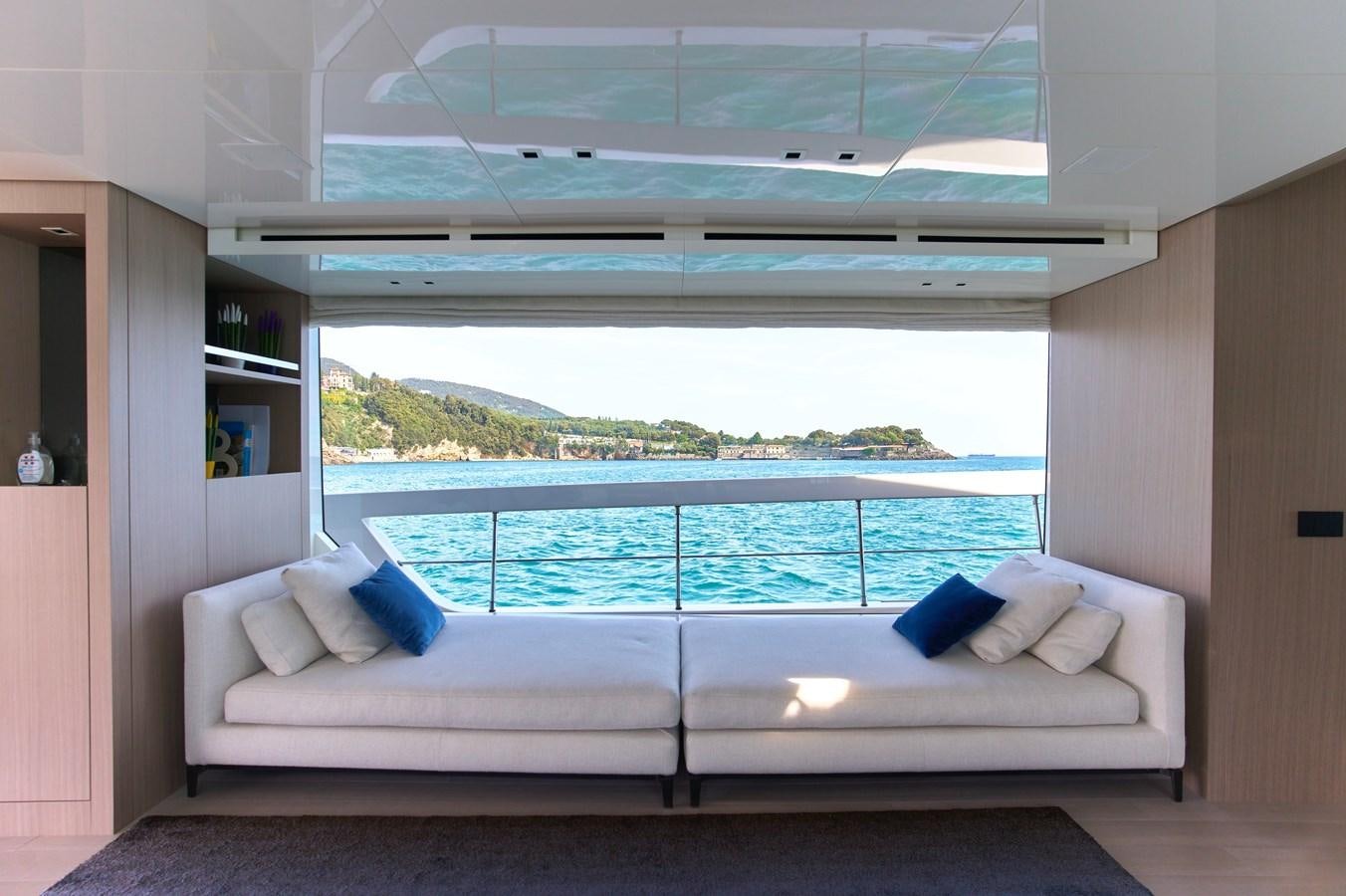 a room with a couch and a window aboard ESTIA Yacht for Sale
