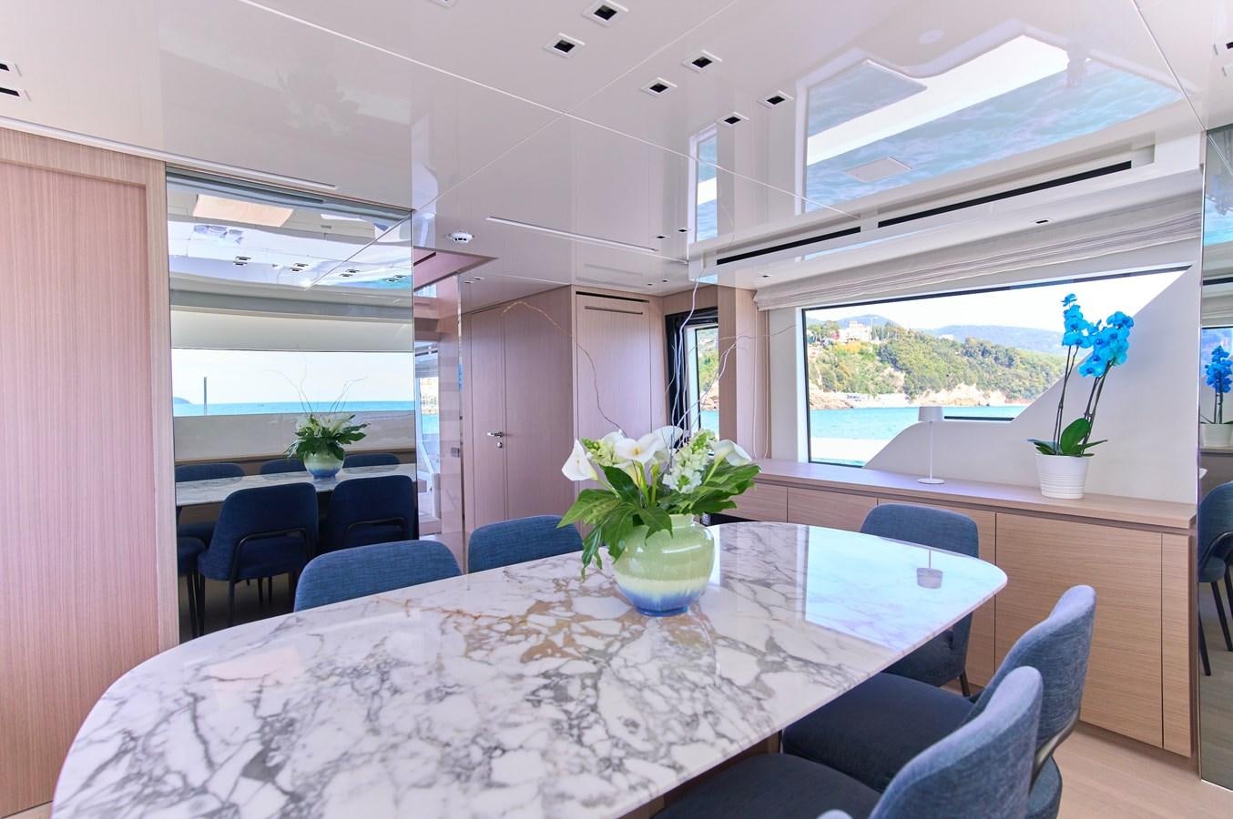 a dining room with a table aboard ESTIA Yacht for Sale