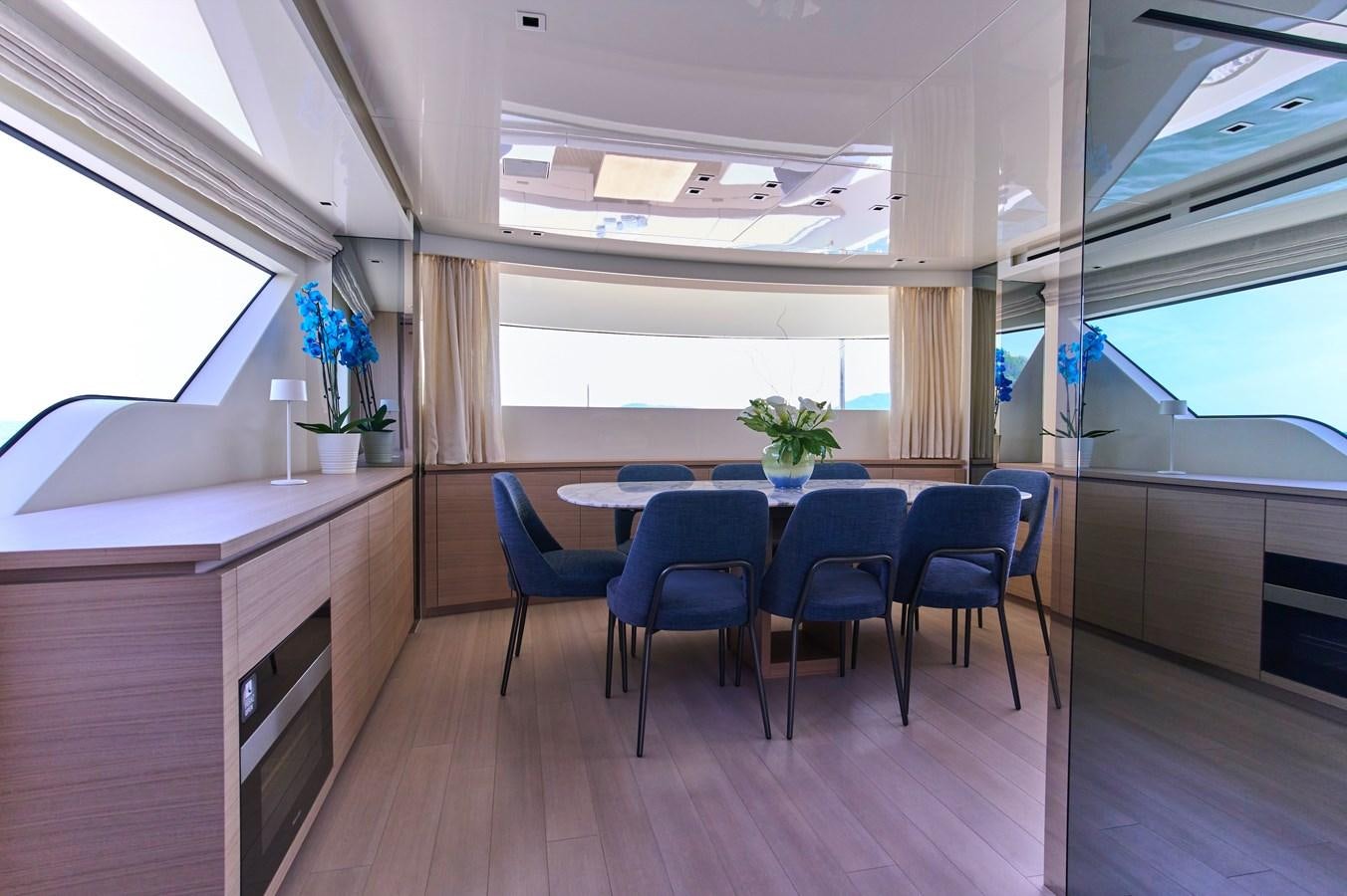 a room with a table and chairs aboard ESTIA Yacht for Sale