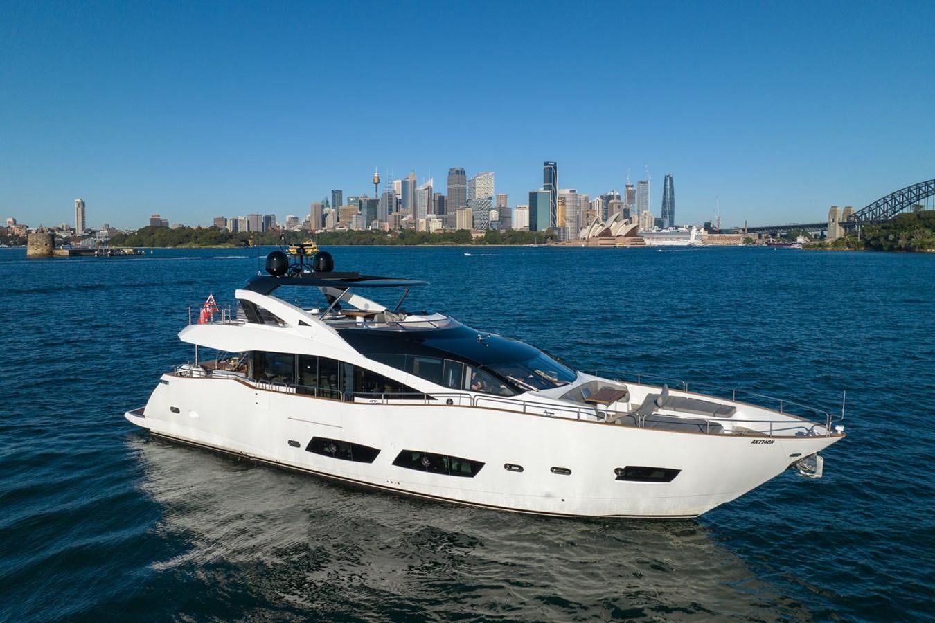 a white yacht on the water aboard ULTRAVIOLET Yacht for Sale